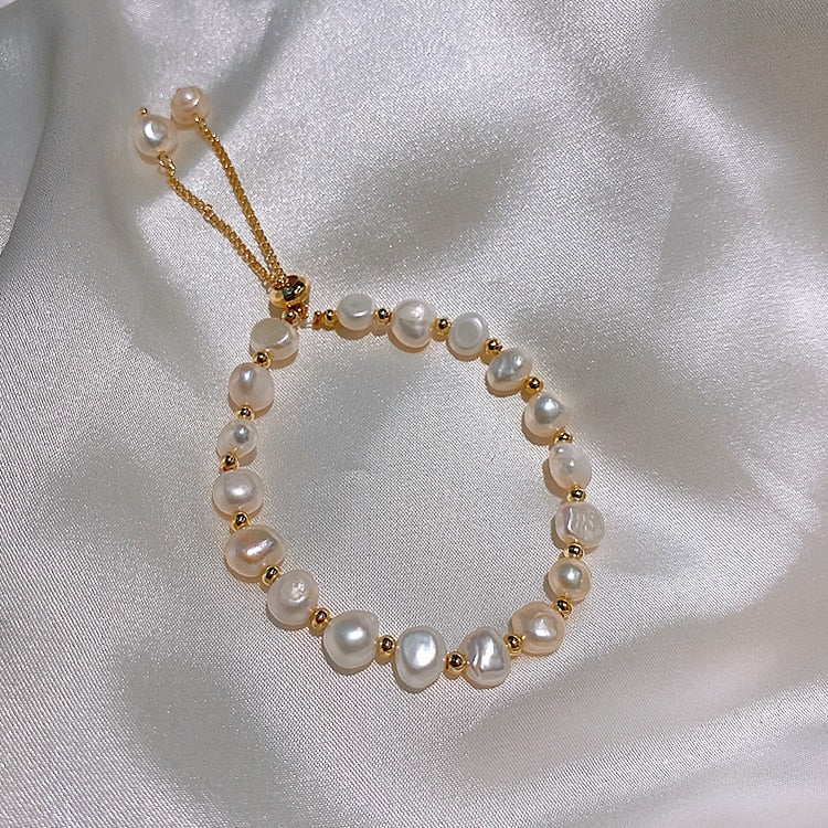 Natural Pearl BraceletM&H FashionM&H FashionThis Natural Pearl Bracelet is a classic piece of jewelry that will never go out of style. It features freshwater pearls in a semi-baroque shape, set in a copper allNatural Pearl Bracelet