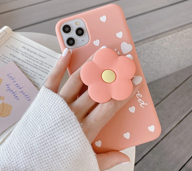 Lovely flower holder stand Soft phone casesM&H FashioniPhoneM&H FashionIntroducing the Lovely Flower Holder Stand Soft Phone Cases for iPhone. This stylish phone case is perfect for adding a touch of elegance to your device. It featuresLovely flower holder stand Soft phone cases
