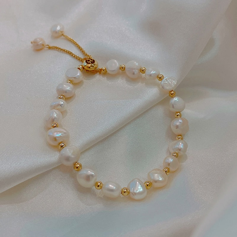 Natural Pearl BraceletM&H FashionM&H FashionThis Natural Pearl Bracelet is a classic piece of jewelry that will never go out of style. It features freshwater pearls in a semi-baroque shape, set in a copper allNatural Pearl Bracelet