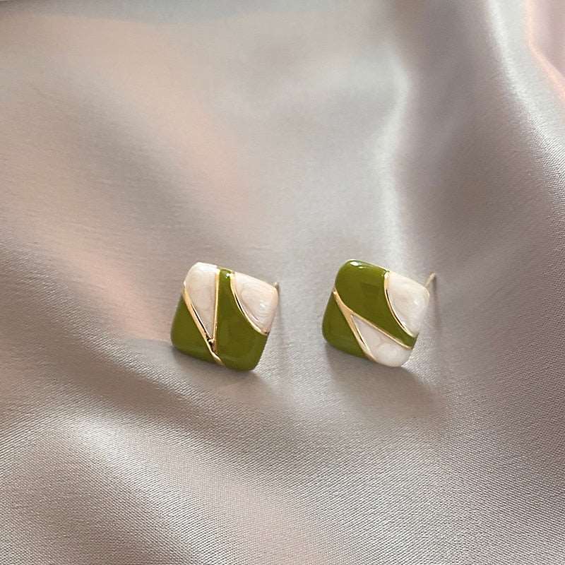 Green White Enamel Square EarringsM&H FashionM&H FashionThese Green White Enamel Square Earrings are the perfect accessory for any outfit. Crafted from copper alloy and metal, these earrings feature a classic style and a Green White Enamel Square Earrings