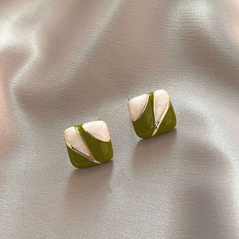 Green White Enamel Square EarringsM&H FashionM&H FashionThese Green White Enamel Square Earrings are the perfect accessory for any outfit. Crafted from copper alloy and metal, these earrings feature a classic style and a Green White Enamel Square Earrings
