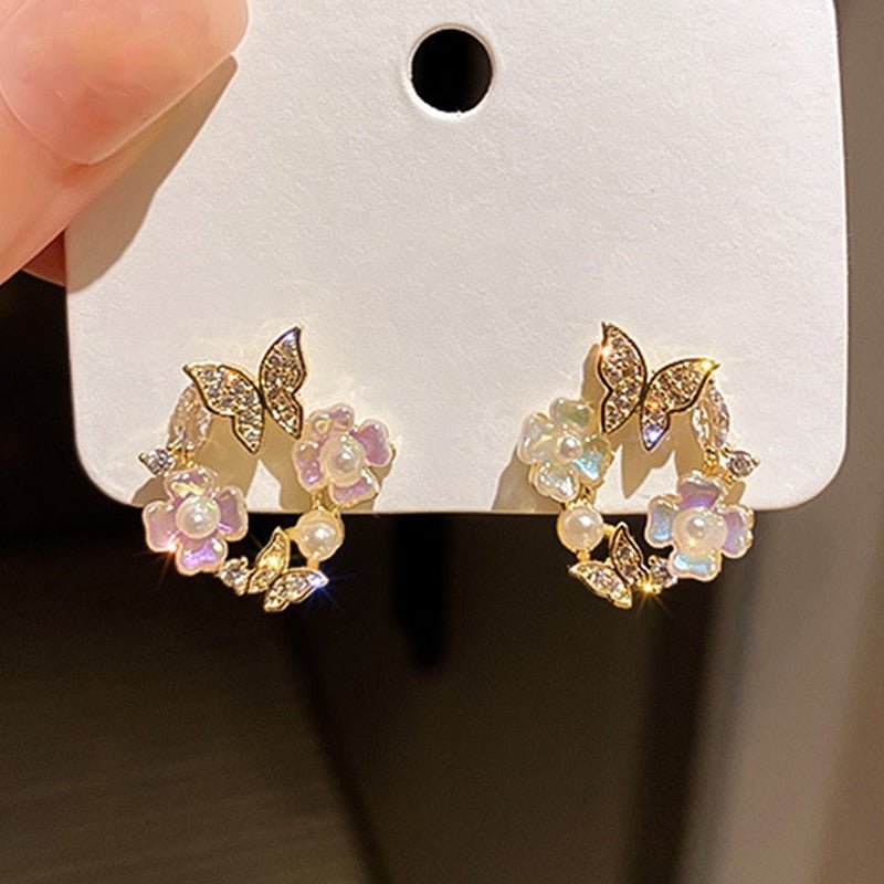 Flower & Butterfly Earrings - M&H FashionFlower & Butterfly EarringsM&H FashionM&H Fashion200001034:200003762#1010Flower & Butterfly EarringsM&H FashionM&H FashionThese Flower &amp; Butterfly Earrings are the perfect accessory for any outfit. With a trendy style and geometric shape, these earrings are sure to make a statement.Flower & Butterfly Earrings