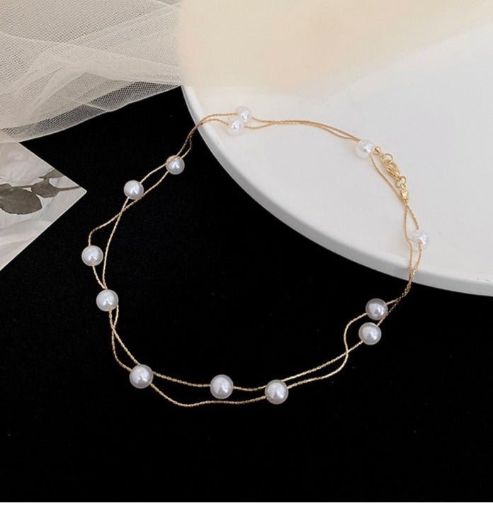 Luxury Double-Layer Pearl String Choker Necklace - M&H FashionLuxury Double-Layer Pearl String Choker NecklaceM&H FashionM&H Fashion200001034:361181Luxury Double-Layer Pearl String Choker NecklaceM&H FashionM&H FashionThis Luxury Double-Layer Pearl String Choker Necklace is a classic piece of jewelry. It features simulated-pearls that are perfectly round. The necklace is made of cLuxury Double-Layer Pearl String Choker Necklace