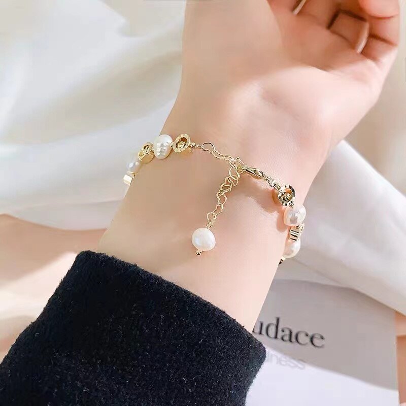 Luxury Natural Pearl Bracelet - M&H FashionLuxury Natural Pearl BraceletM&H FashionM&H Fashion200001034:361181;200000639:2832Luxury Natural Pearl BraceletM&H FashionM&H FashionThis Luxury Natural Pearl Bracelet is a timeless classic. Crafted with freshwater pearls and set in a pave setting, this bracelet is sure to make a statement. The coLuxury Natural Pearl Bracelet