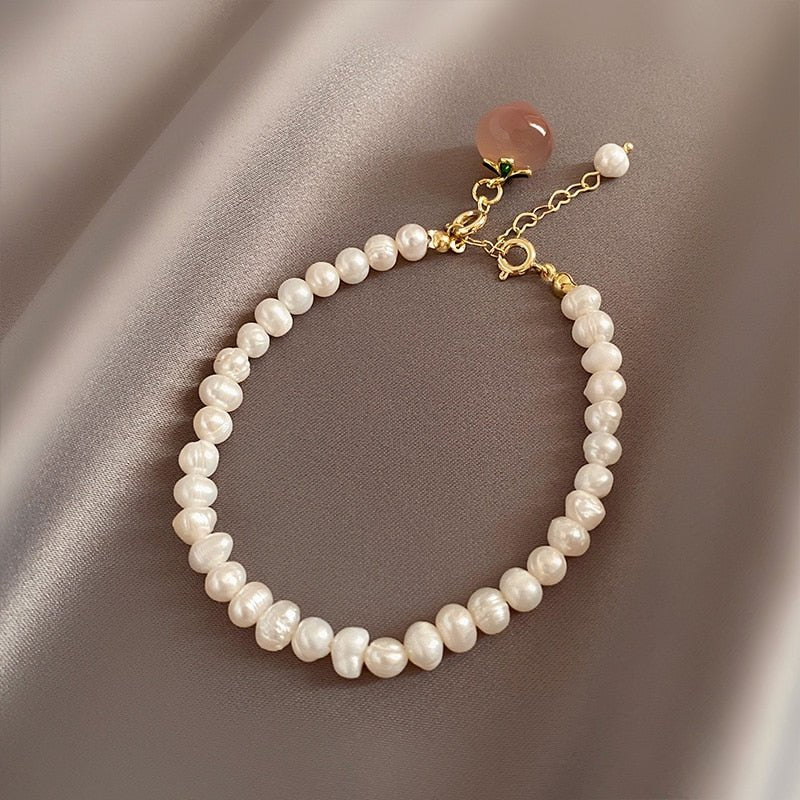 Peach Bracelet - M&H FashionPeach BraceletM&H FashionM&H Fashion200001034:361181Peach BraceletM&H FashionM&H FashionThis Peach Bracelet is a classic piece of jewelry that will never go out of style. Crafted with freshwater pearls in a baroque shape, this bracelet is made with coppPeach Bracelet