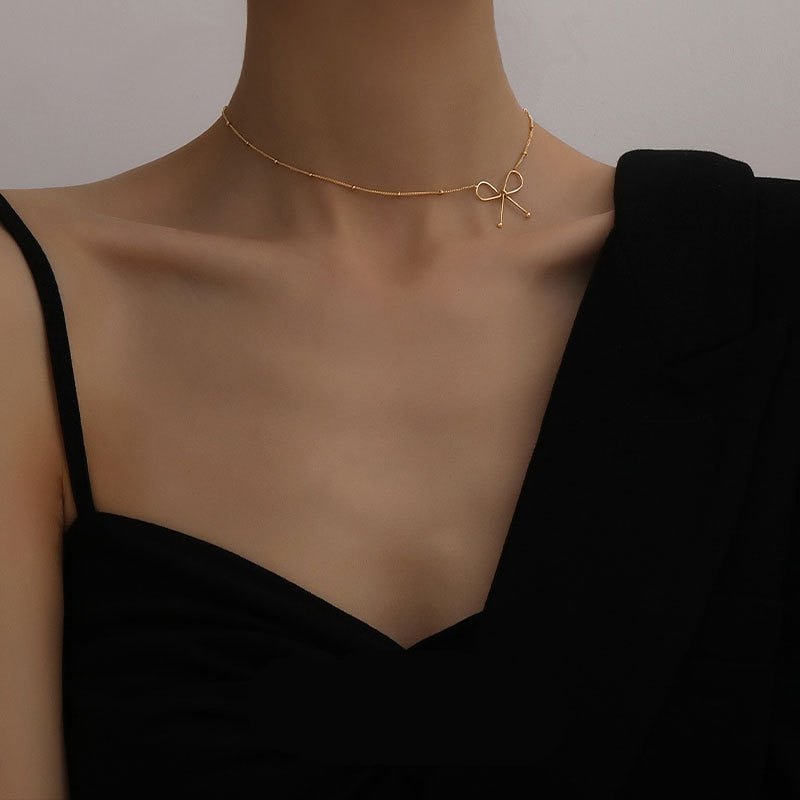 Stylish gold-plated bow charm necklace - M&H FashionStylish gold-plated bow charm necklaceM&H FashionM&H Fashion200001034:361180#N147Stylish gold-plated bow charm necklaceM&H FashionM&H FashionThis stylish gold-plated bow charm necklace is the perfect accessory for any outfit. It features a bowknot shape and is made of stainless steel and metal. The necklaStylish gold-plated bow charm necklace