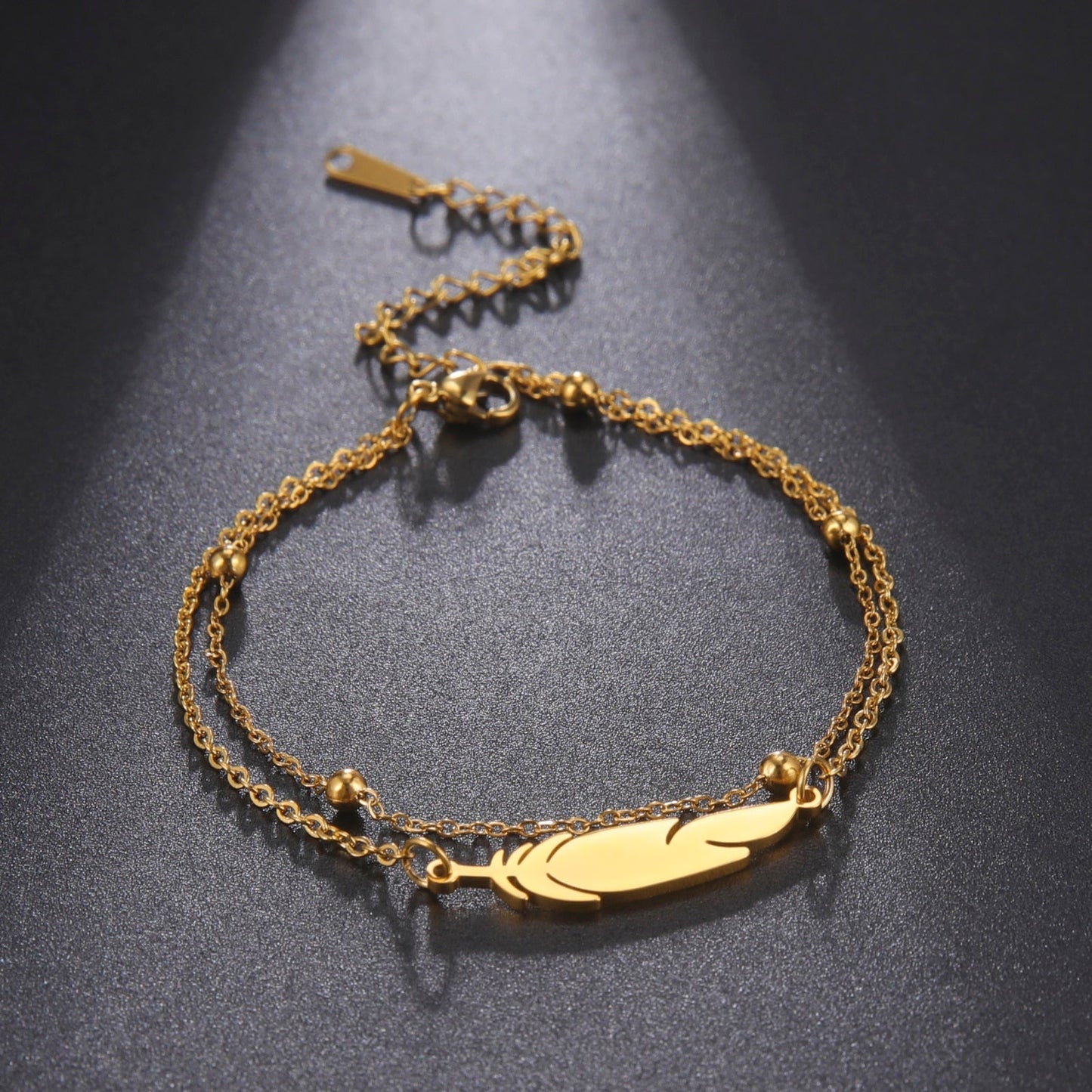 Trendy Anklet - M&H FashionTrendy AnkletM&H FashionM&H Fashion200001034:361187#Gold colorGold colorTrendy AnkletM&H FashionM&H FashionThis Trendy Anklet is the perfect accessory for any outfit. It features a feather and double chain design, made from stainless steel and metal. The length is 21cm+5cTrendy Anklet