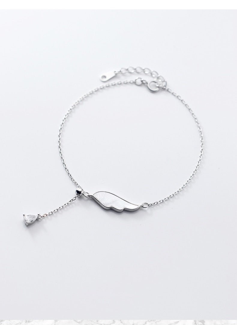 White Shell Wings Tassel bracelet ( 925 Sterling Silver) - M&H FashionWhite Shell Wings Tassel bracelet ( 925 Sterling Silver)M&H FashionM&H Fashion200000226:29#Silver ColorSilver ColorWhite Shell Wings Tassel bracelet ( 925 Sterling Silver)M&H FashionM&H FashionThis White Shell Wings Tassel Bracelet (925 Sterling Silver) is the perfect accessory for any occasion. It is made with 925 Sterling Silver and features a unique geoWhite Shell Wings Tassel bracelet ( 925 Sterling Silver)